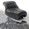 Black two-up motorcycle seat with quilted diamond stitching and padded rider backrest