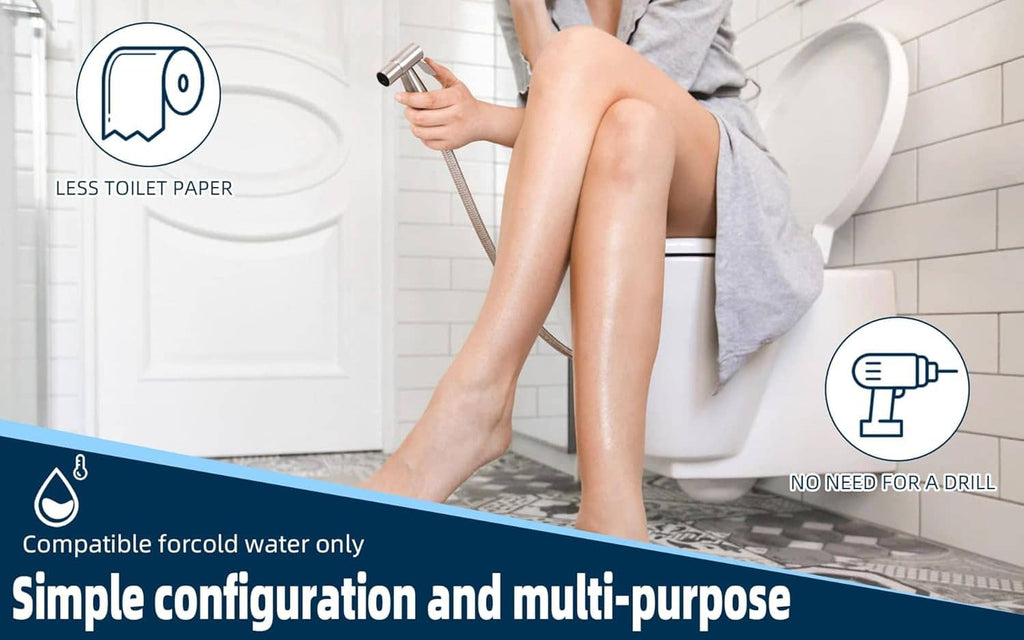 Handheld stainless steel bidet sprayer held near toilet bowl for water spray