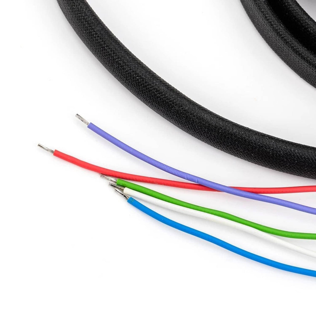 Color-coded ignition module wires with crimp terminals in blue, green, red, and purple