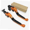 Orange and black motorcycle brake and clutch levers shown with packaging box