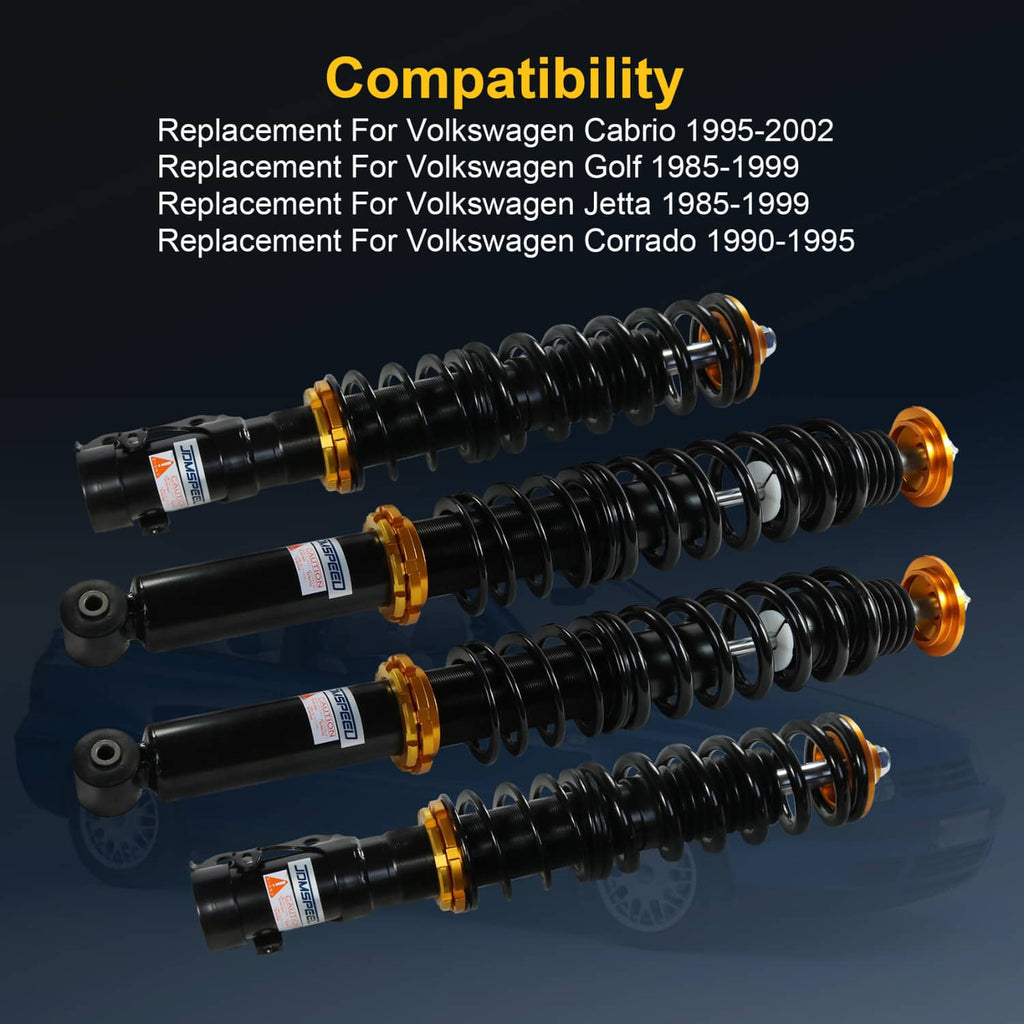 Set of coilover struts with black springs and gold mounting hardware