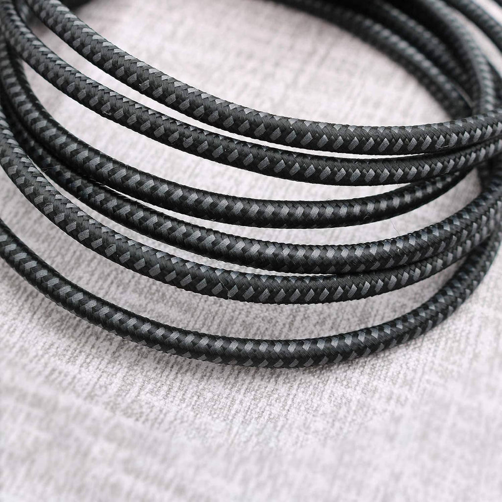 Close-up of braided black USB-C cable jacket texture, short USB-C to USB-C leads