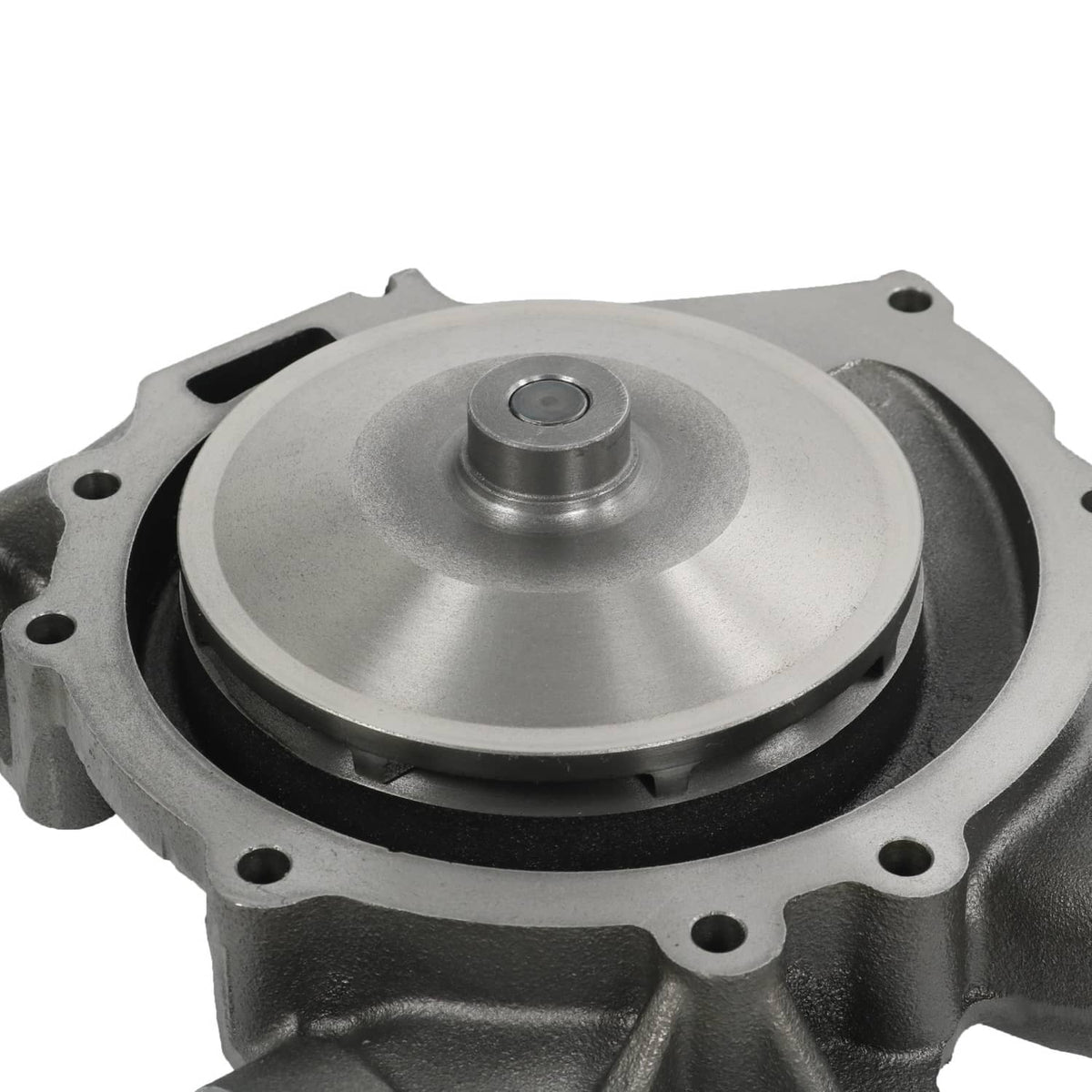 Close-up of water pump impeller cover with bolt holes, gray cast housing