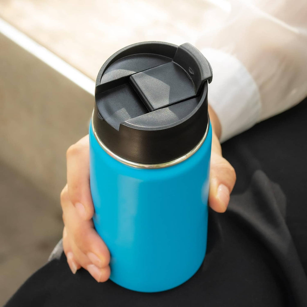 Black flip lid open on bottle, showing cover and drinking opening