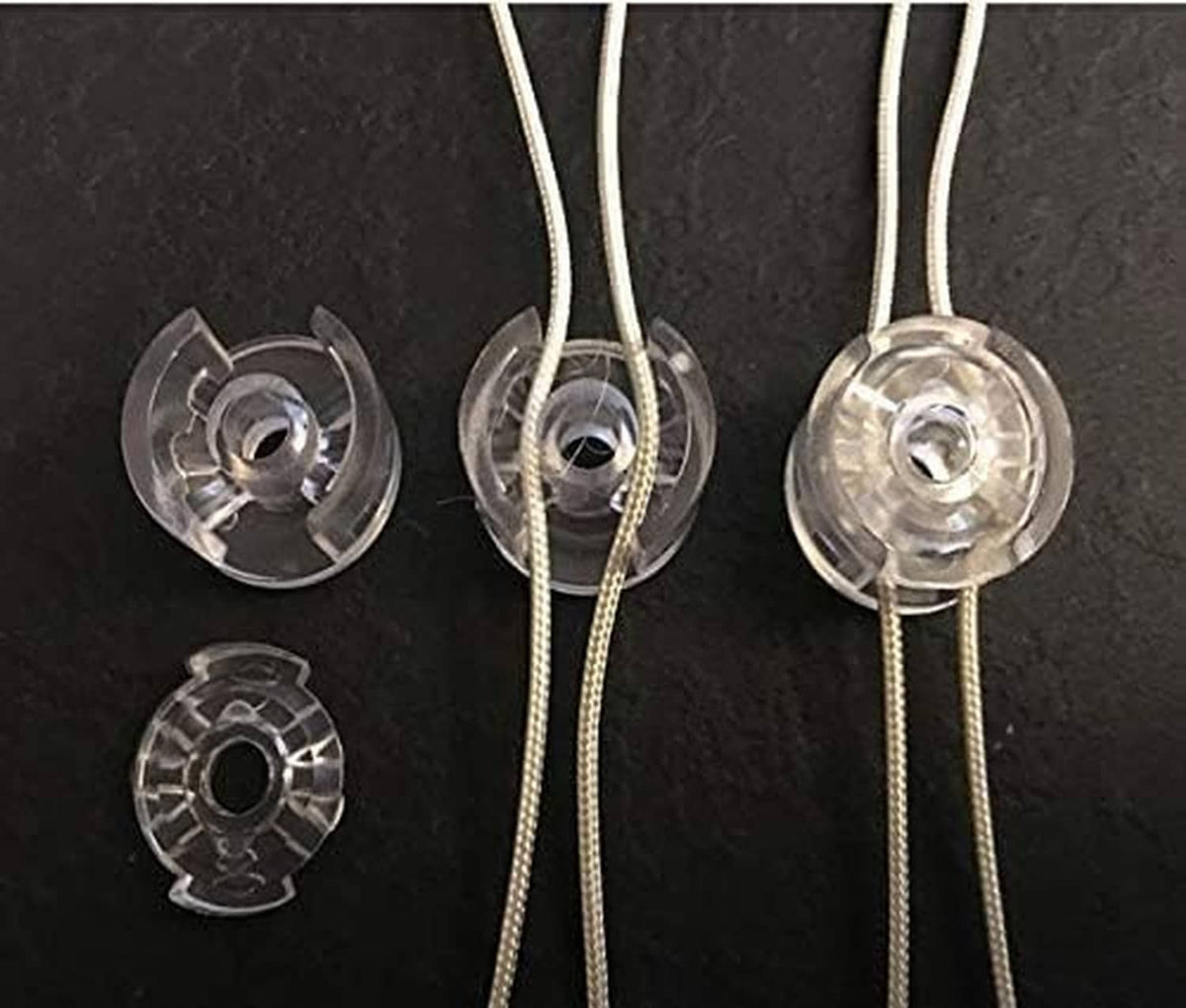 Clear cord tensioner clips with metal inserts, for roller shade cords