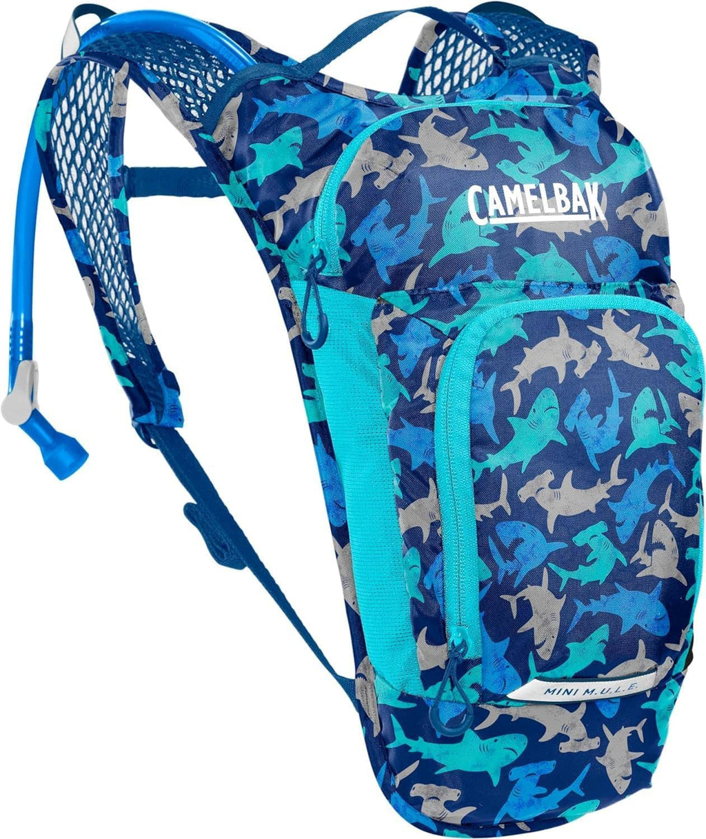 Kids hydration backpack by Camelbak, blue shark print front, Camelbak logo and webbing straps