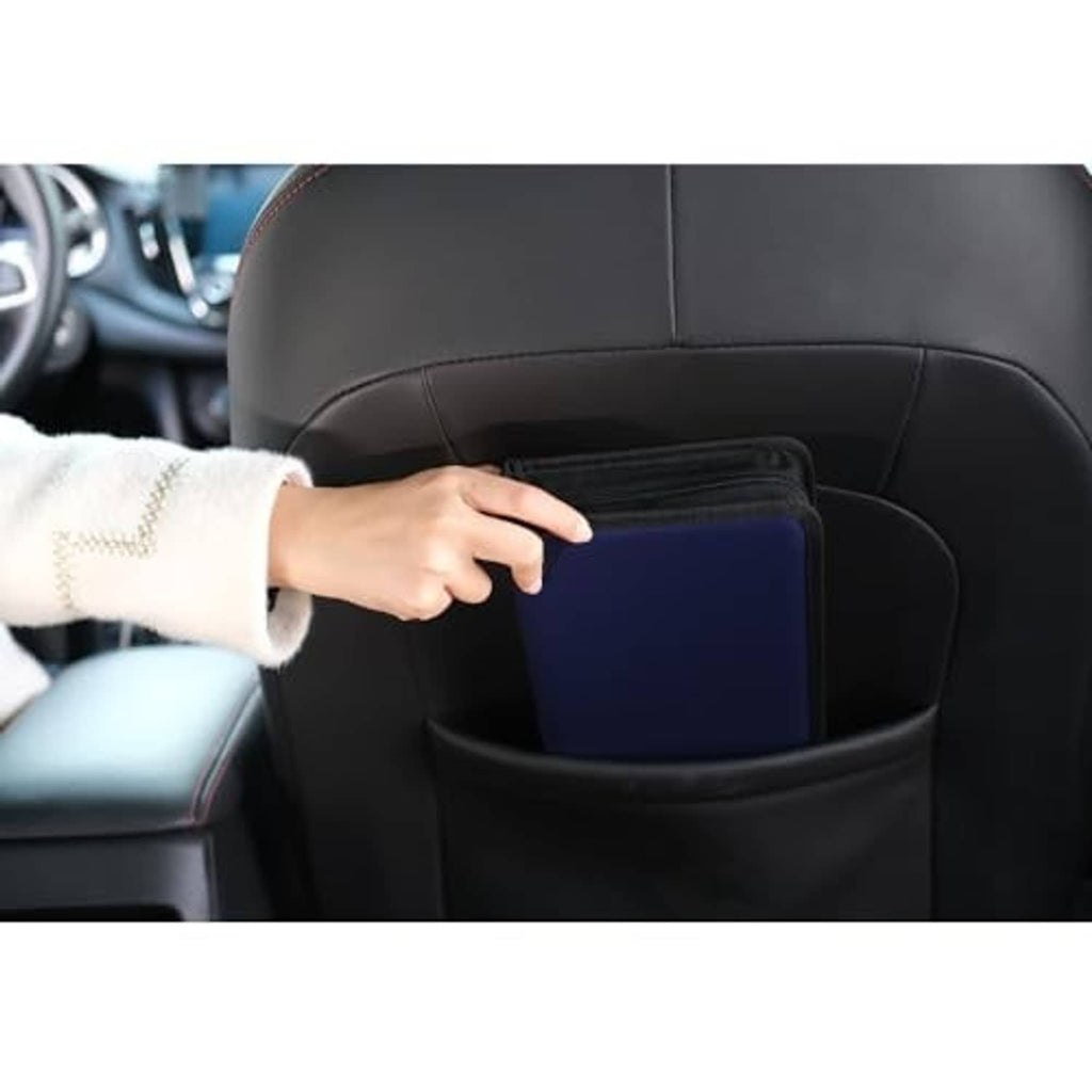 Black PU leather CD/DVD case with zipper in car seat organizer pocket, held by hand
