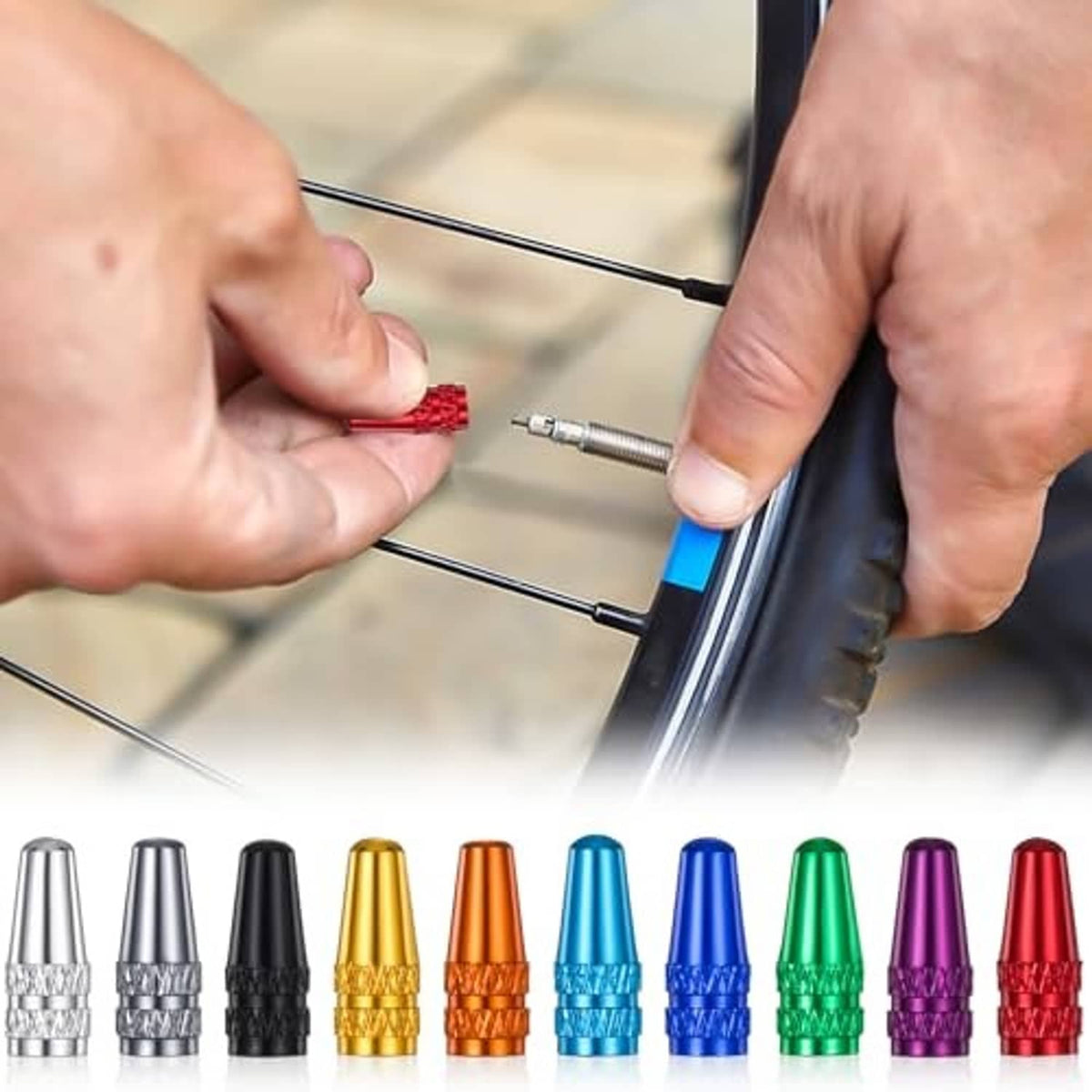Red aluminum Presta valve cap being screwed onto a bicycle valve stem
