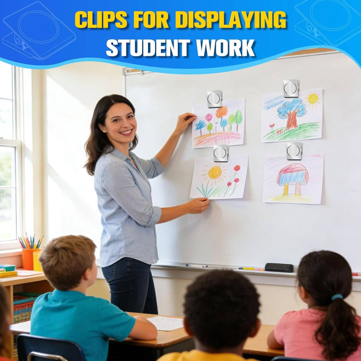Silver magnetic clips holding student artwork on a board; rounded magnet faces