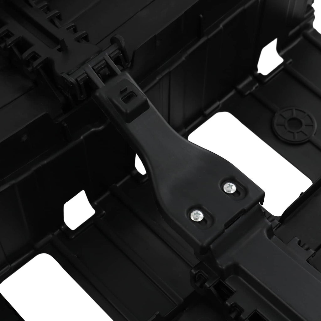 Close-up of black radiator shutter assembly with metal screws and molded tabs
