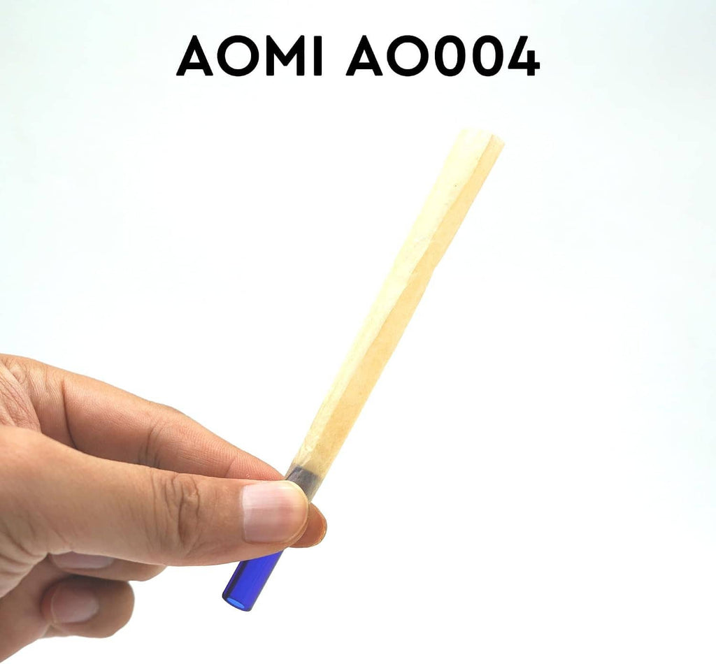 Hand holding a yellow reusable glass filter tip mouthpiece