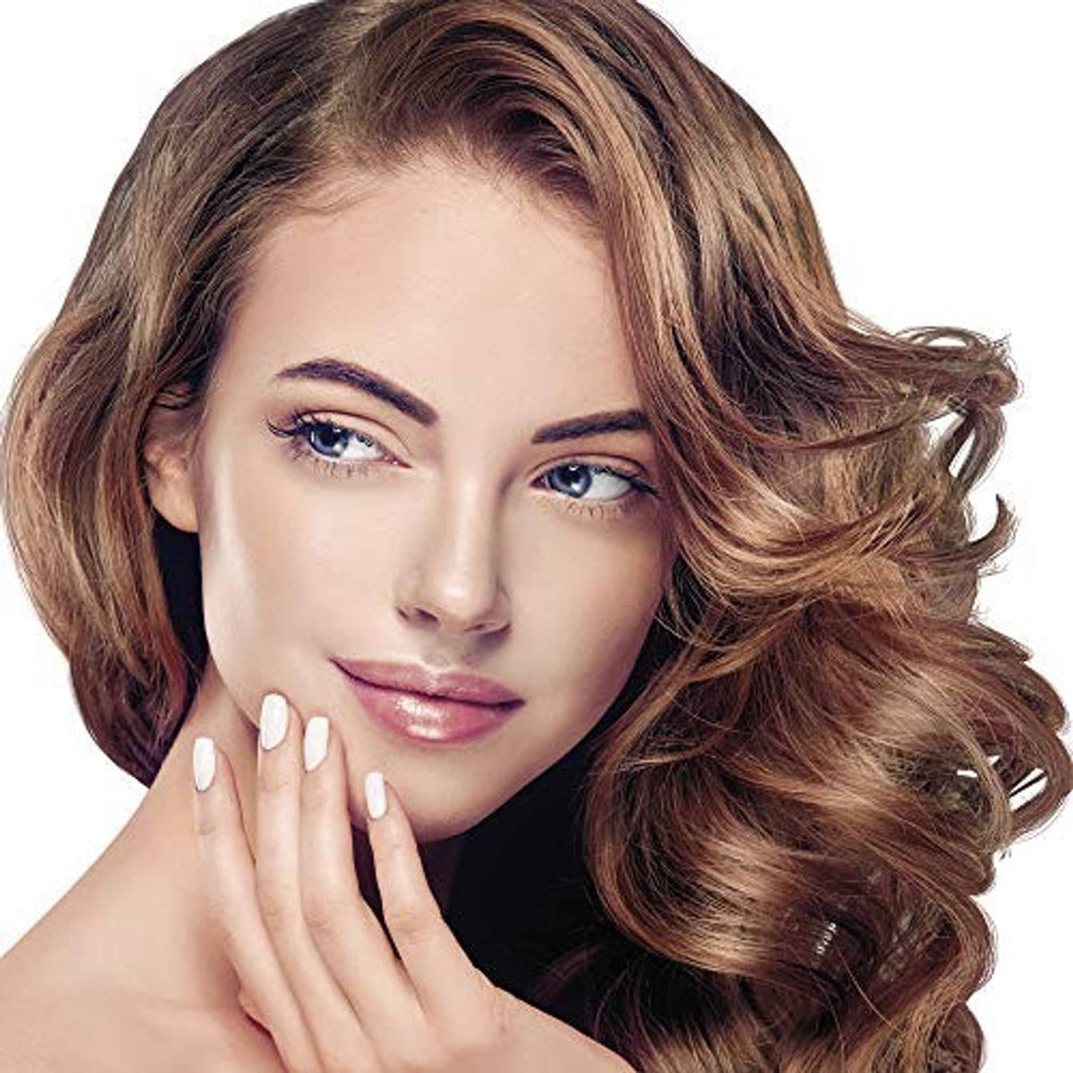 Woman with voluminous styled hair featuring soft curls and warm highlights