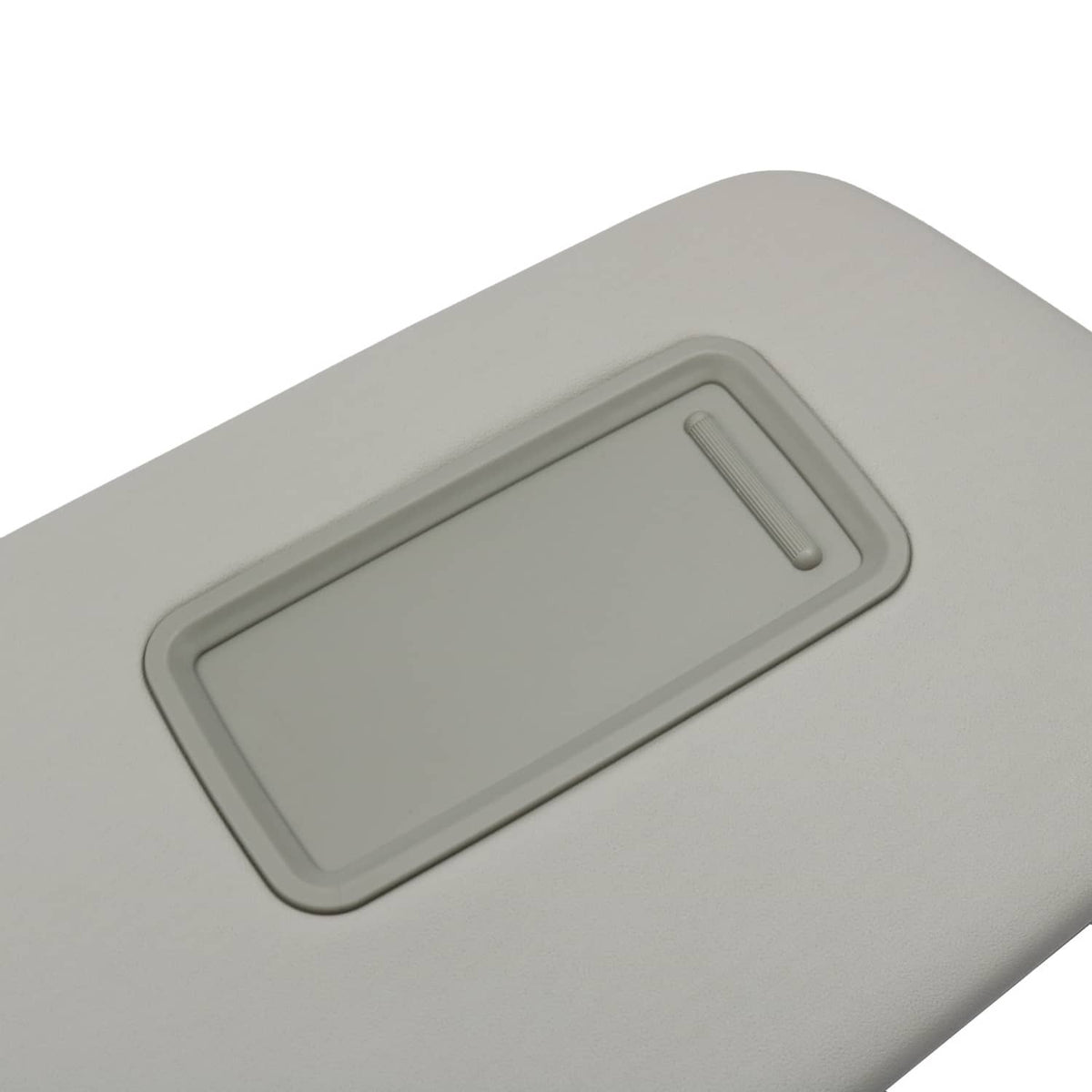 Gray sun visor underside with recessed handle slot for mirror cover