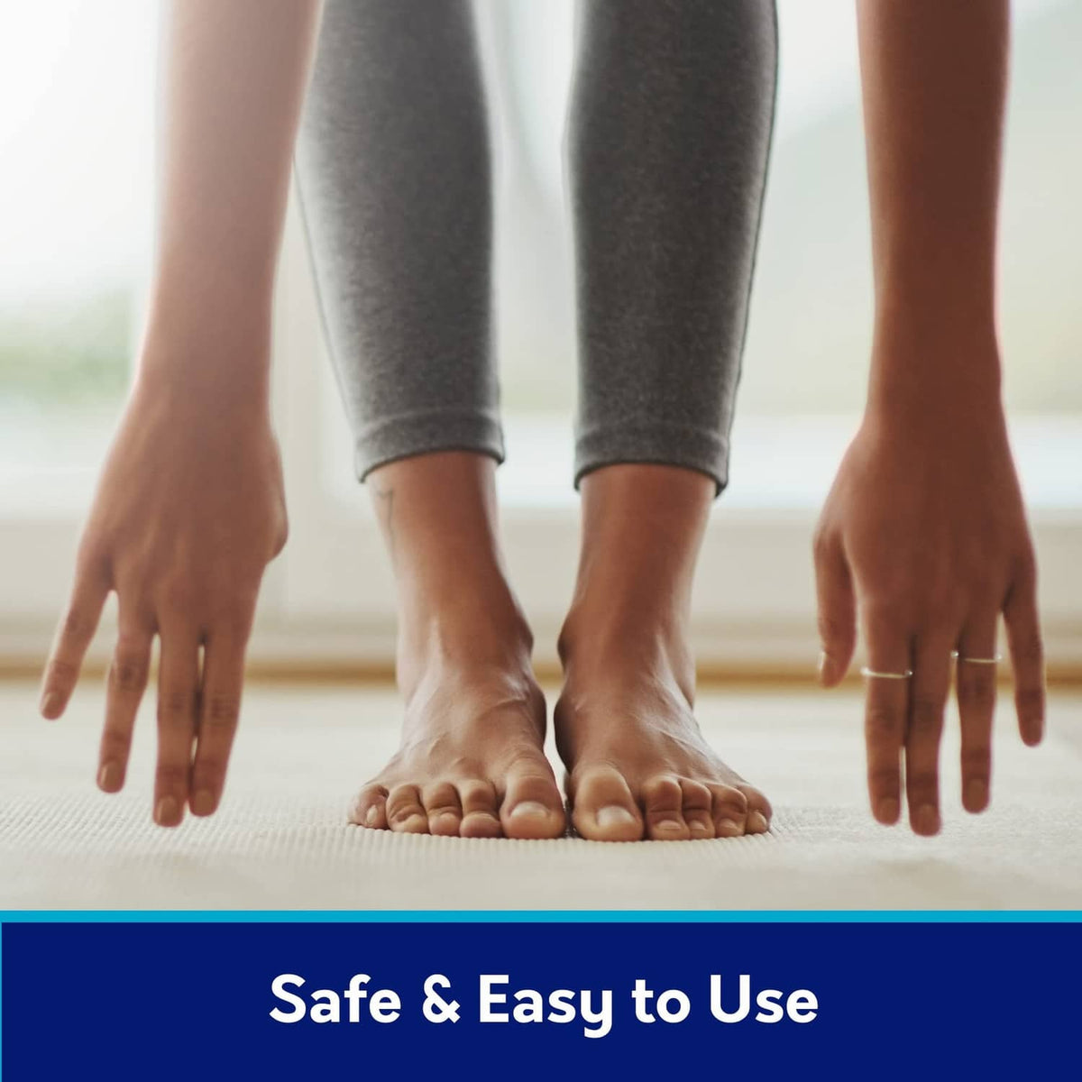 Wart remover use shown: hands reaching toward bare feet on a floor surface