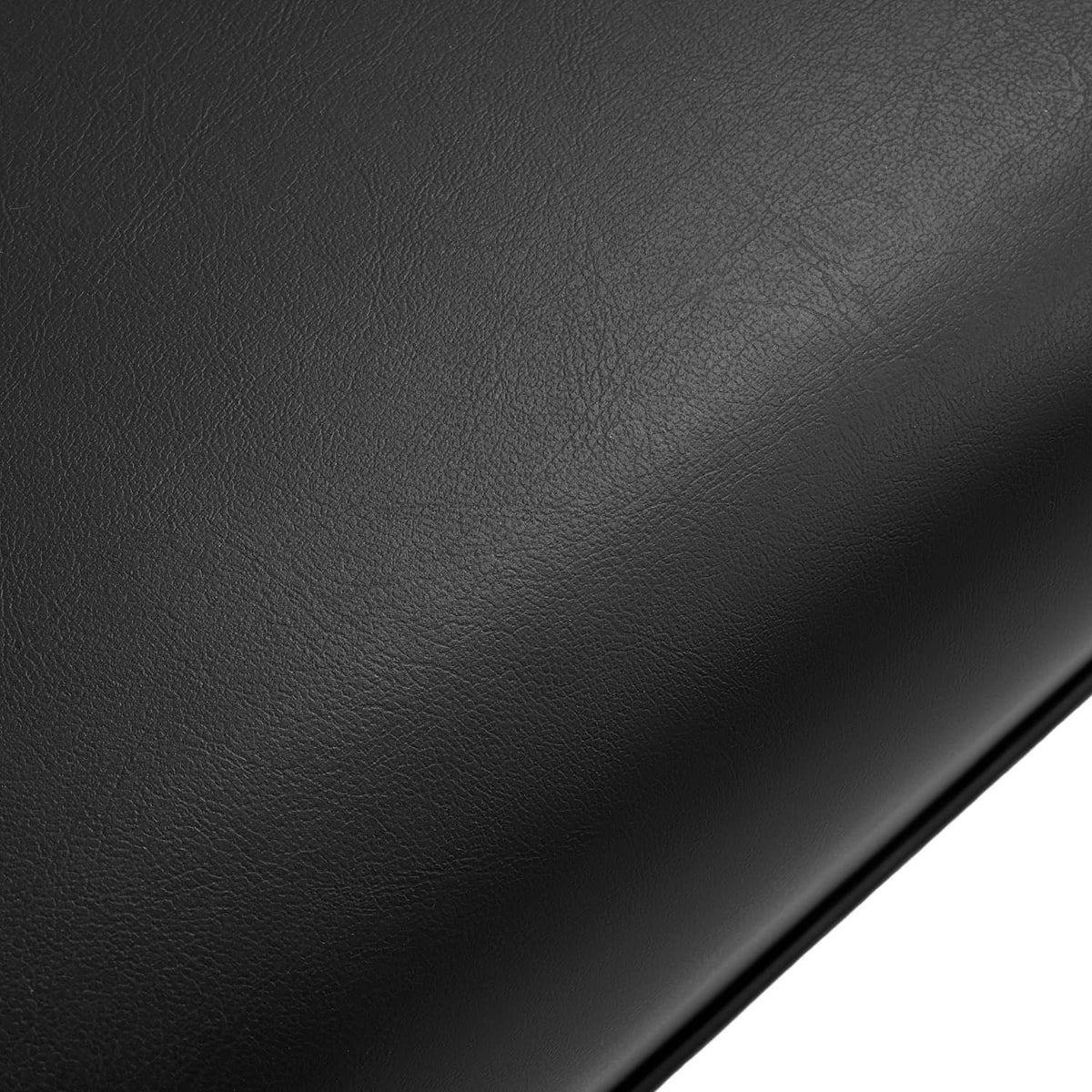 Black vinyl seat cushion back panel with textured grain surface