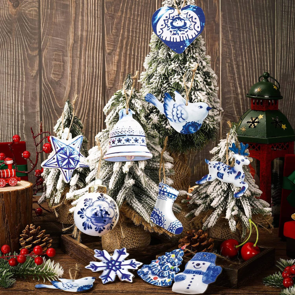 Blue-and-white porcelain ornaments hanging on a small decorated Christmas tree display.