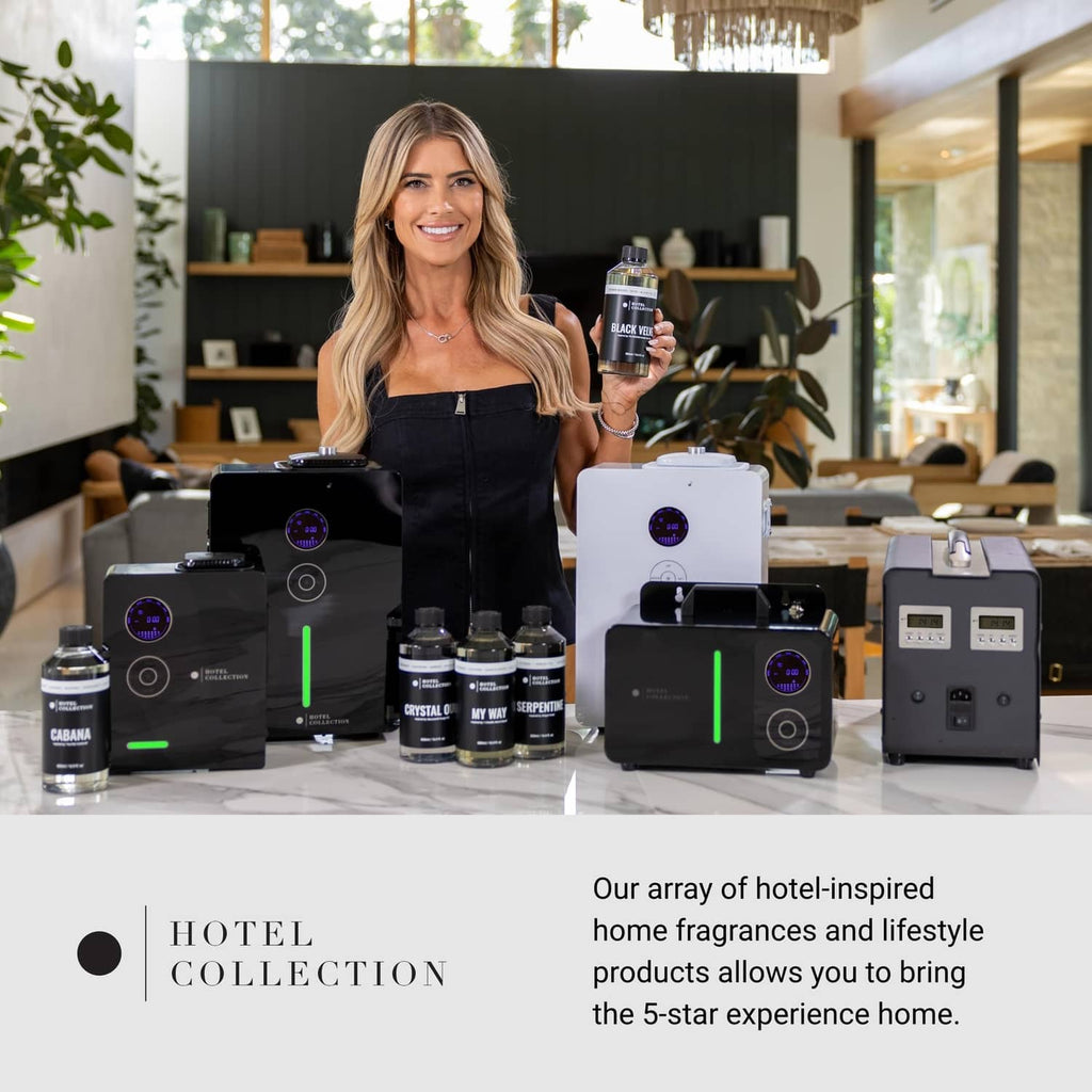 Sweetest Taboo aroma diffuser oil bottle held up with Hotel Collection product boxes