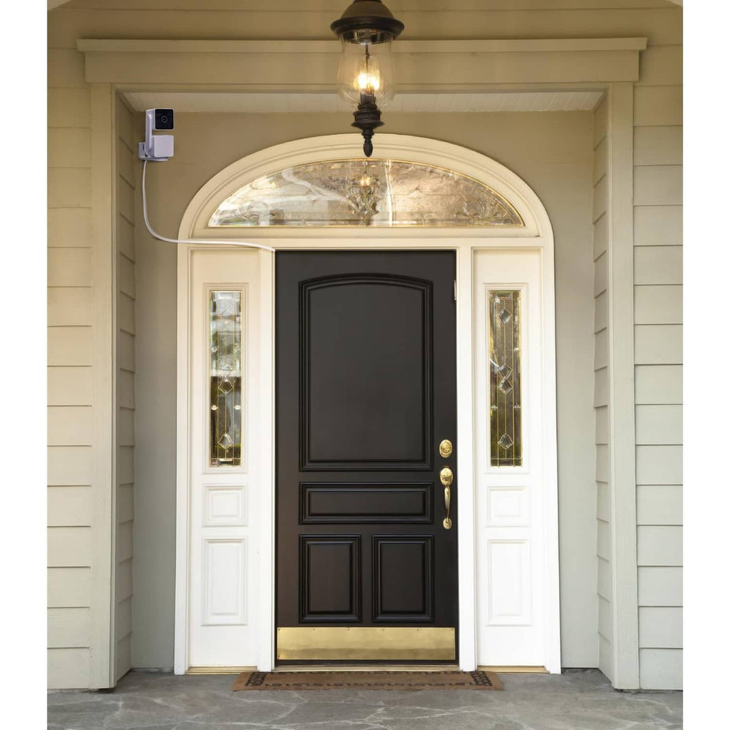 White micro USB power cable installed near front door for security camera