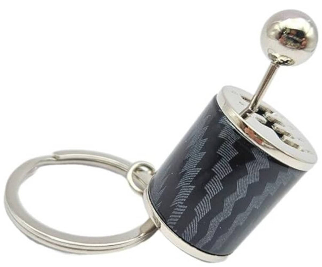 Carbon-fiber style canister keychain charm with metal top and key ring
