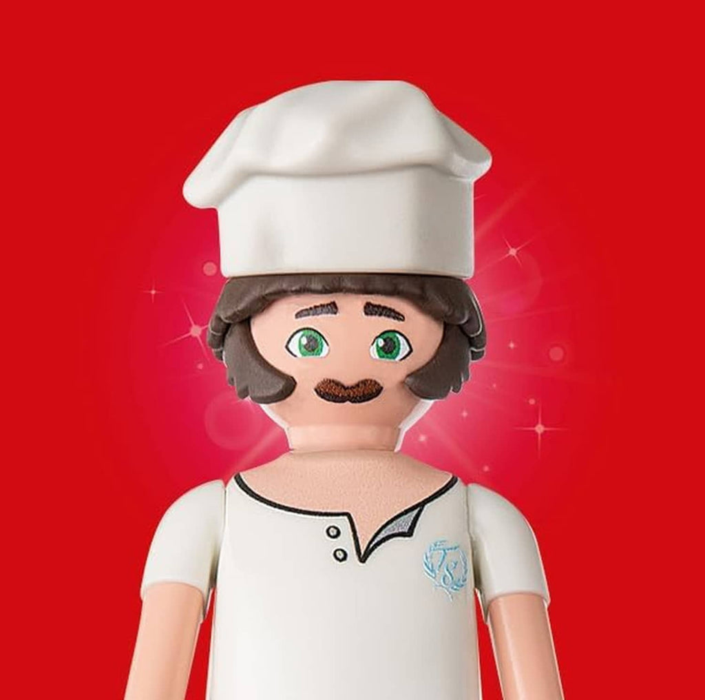 Chef doll figure with white toque, green eyes, and white chef coat
