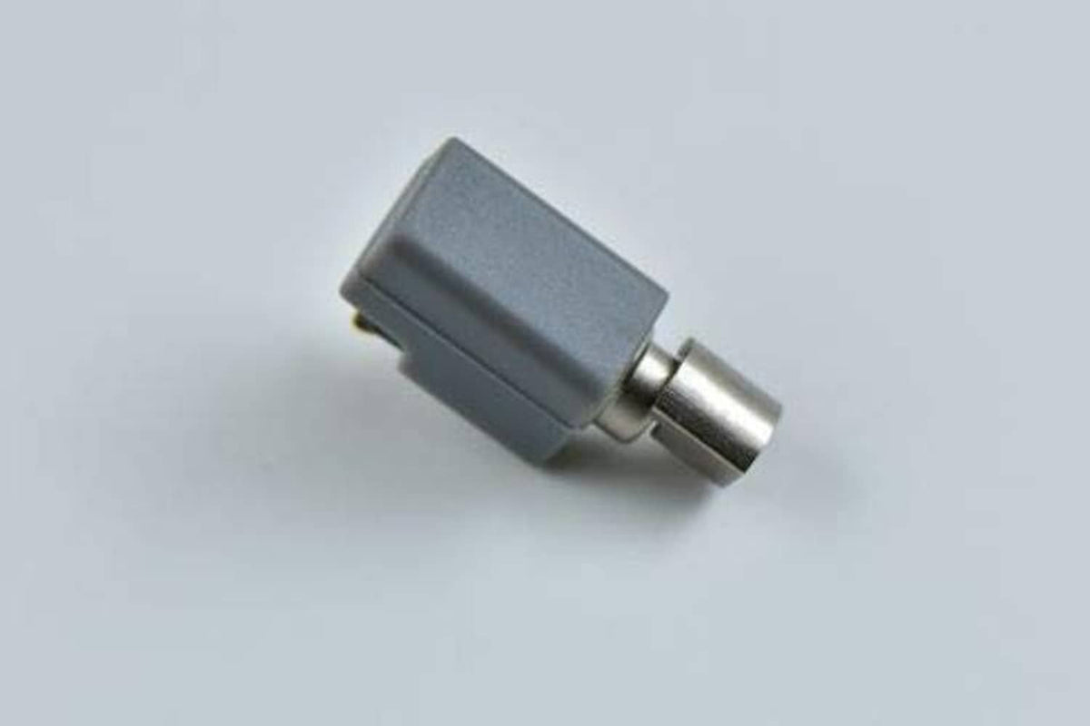 Grey vibration motor with metal shaft and side connector, compact view