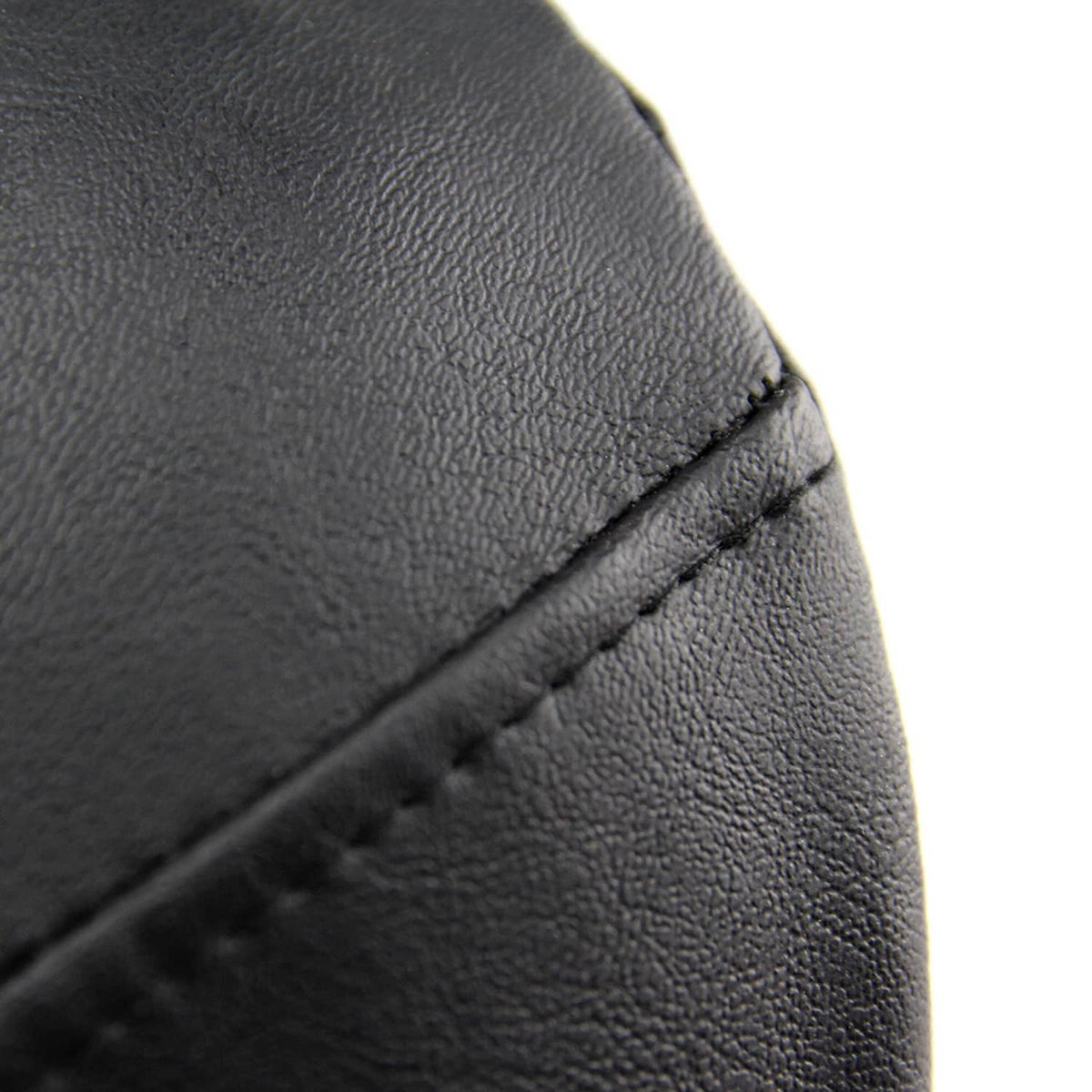 Close-up of black stitched motorcycle seat cover texture