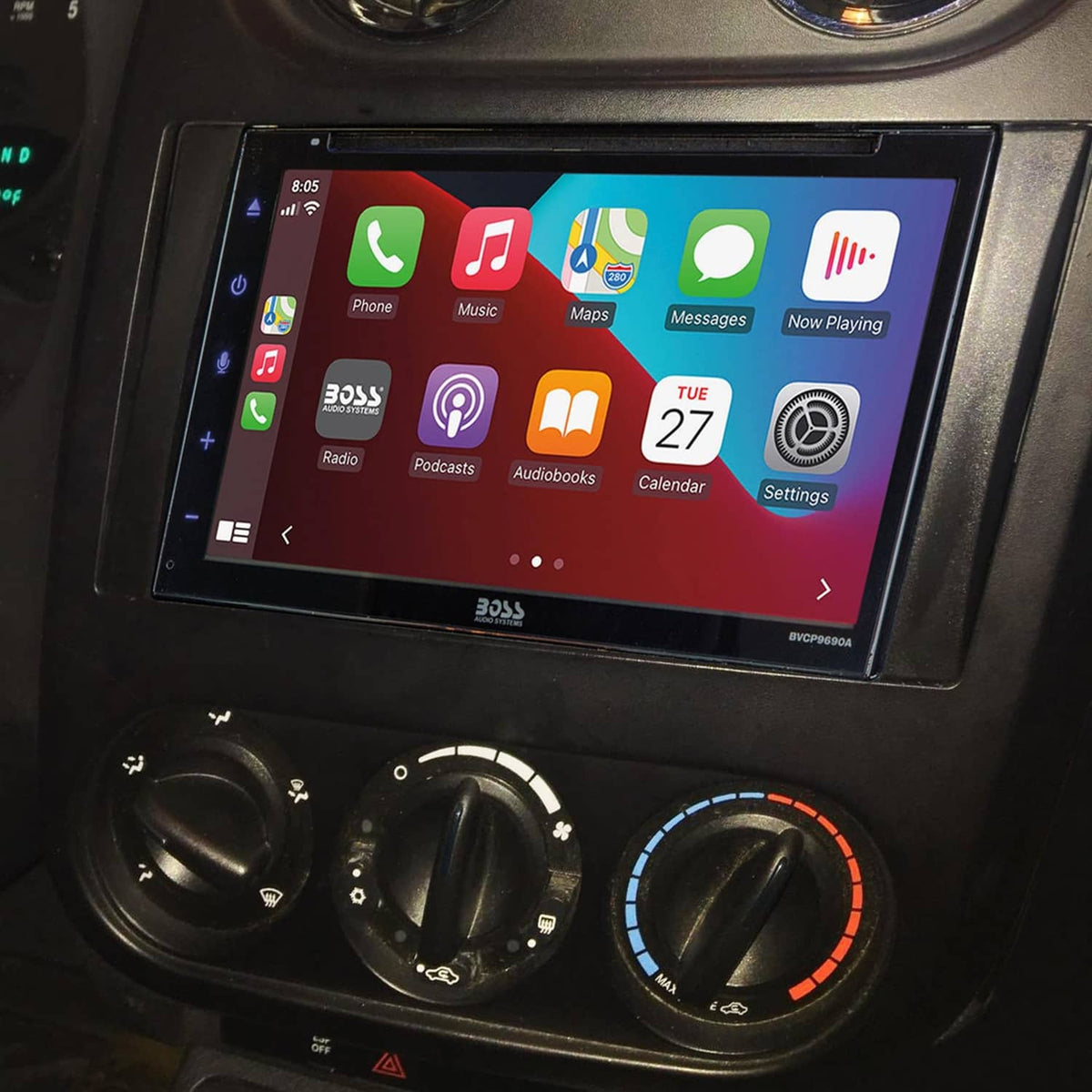 Double DIN stereo touchscreen head unit installed with climate and control knobs below