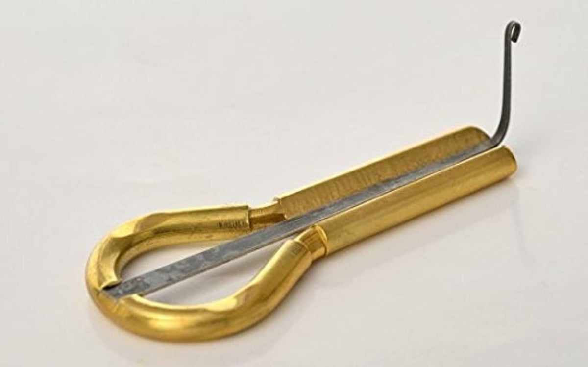Gold metal vargan jaw harp with long tuning tine and grey resonator bar