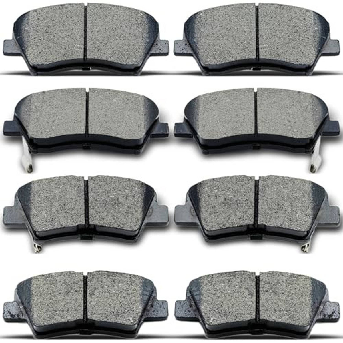 8-piece set of gray ceramic brake pads with black backing, visible center grooves