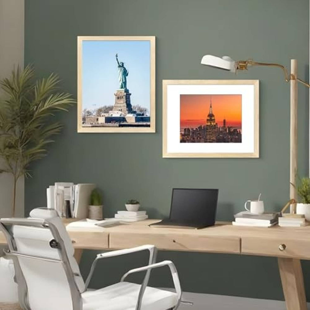 Two natural wood wall picture frames with white mats and photo inserts