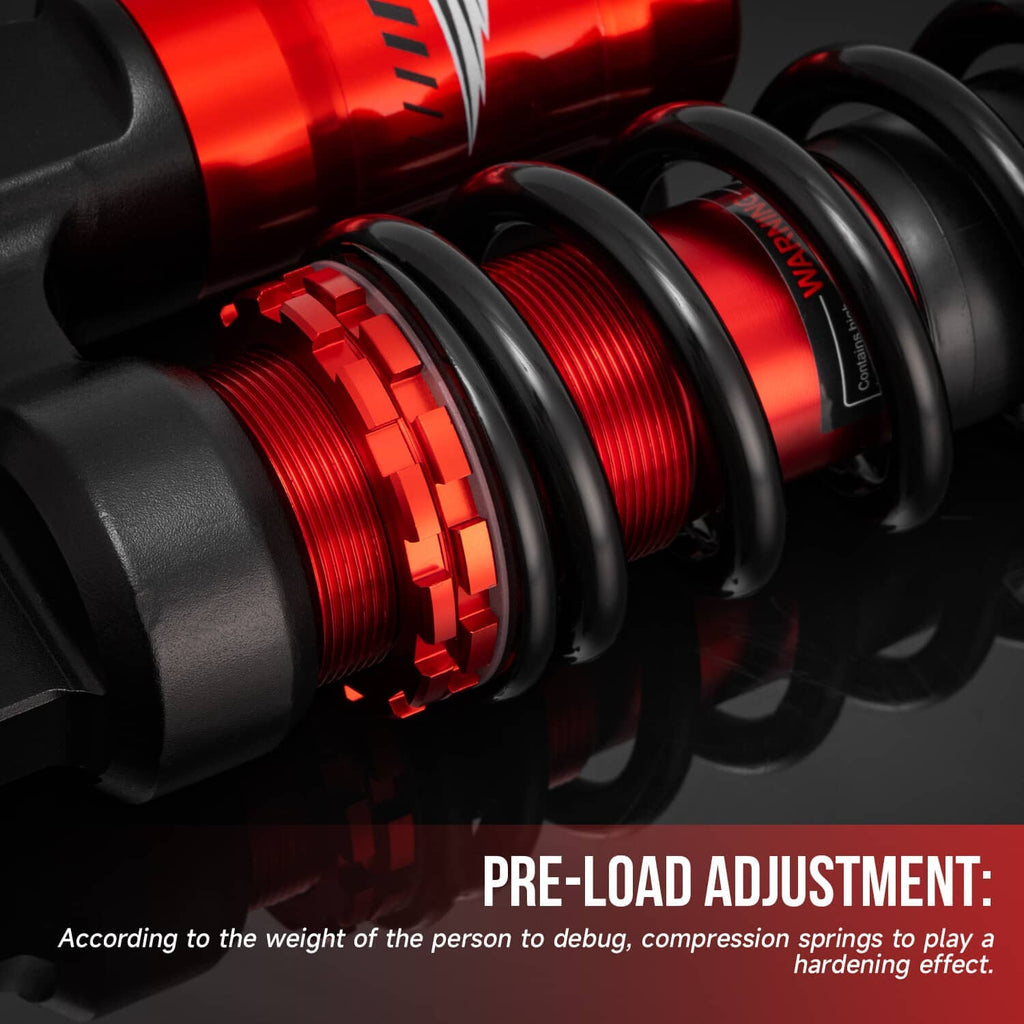 Air shock absorber close-up with red threaded preload adjuster ring and black coils