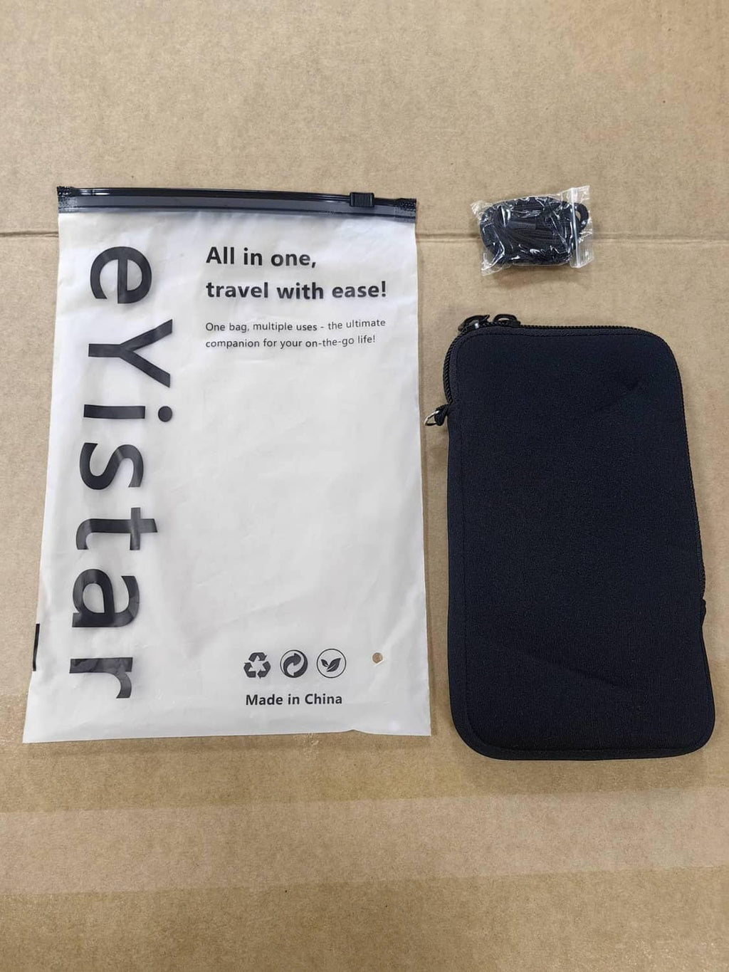 Black zippered phone sleeve pouch with retail package bag included