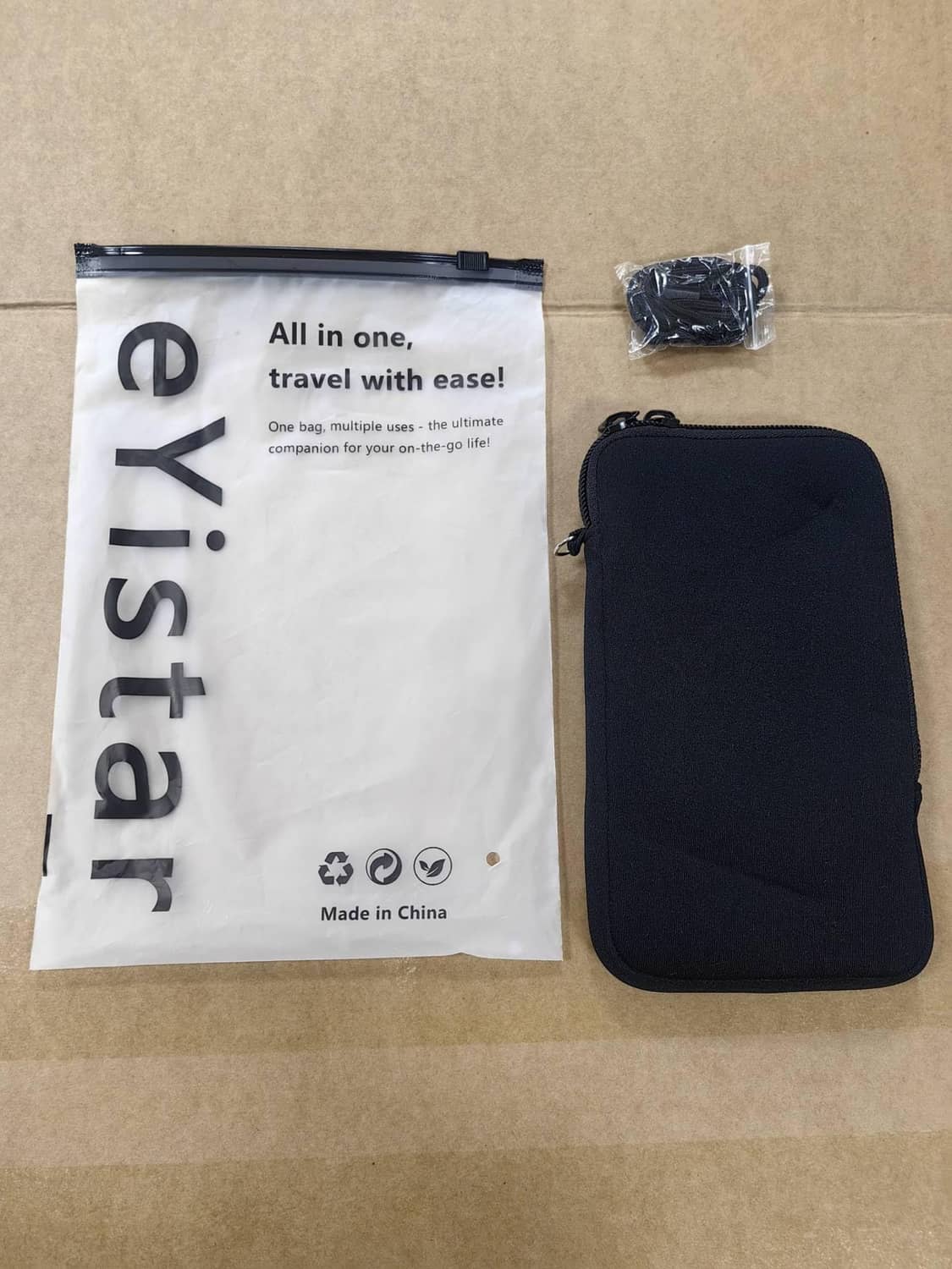 Black zippered phone sleeve pouch with retail package bag included