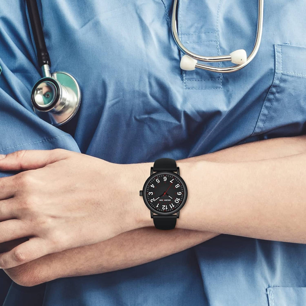 Black nurse watch on wrist with round dial and black silicone strap, front-facing