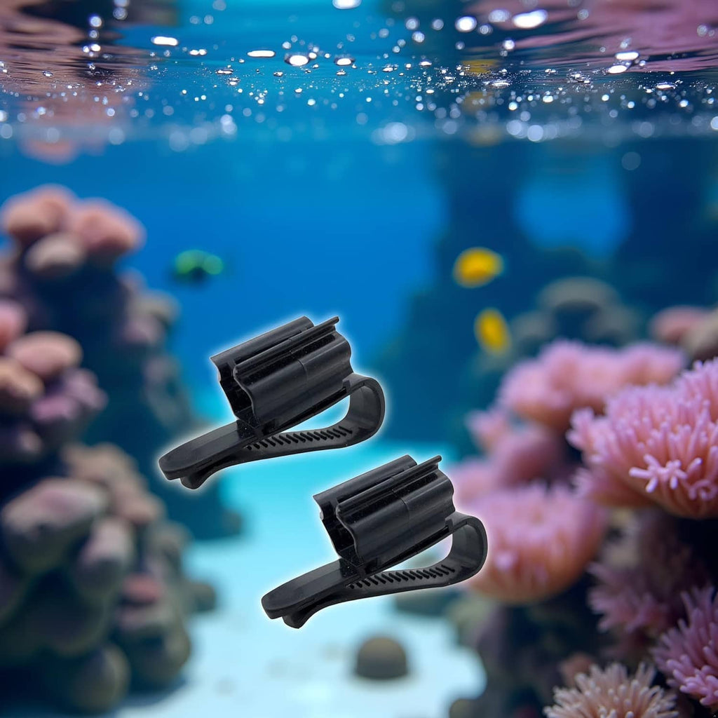 Two black fish tank hose clips floating in water scene, curved ridged holders