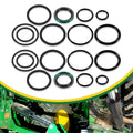 Hydraulic stabilizer cylinder seal kit with multiple black O-rings and green seal rings