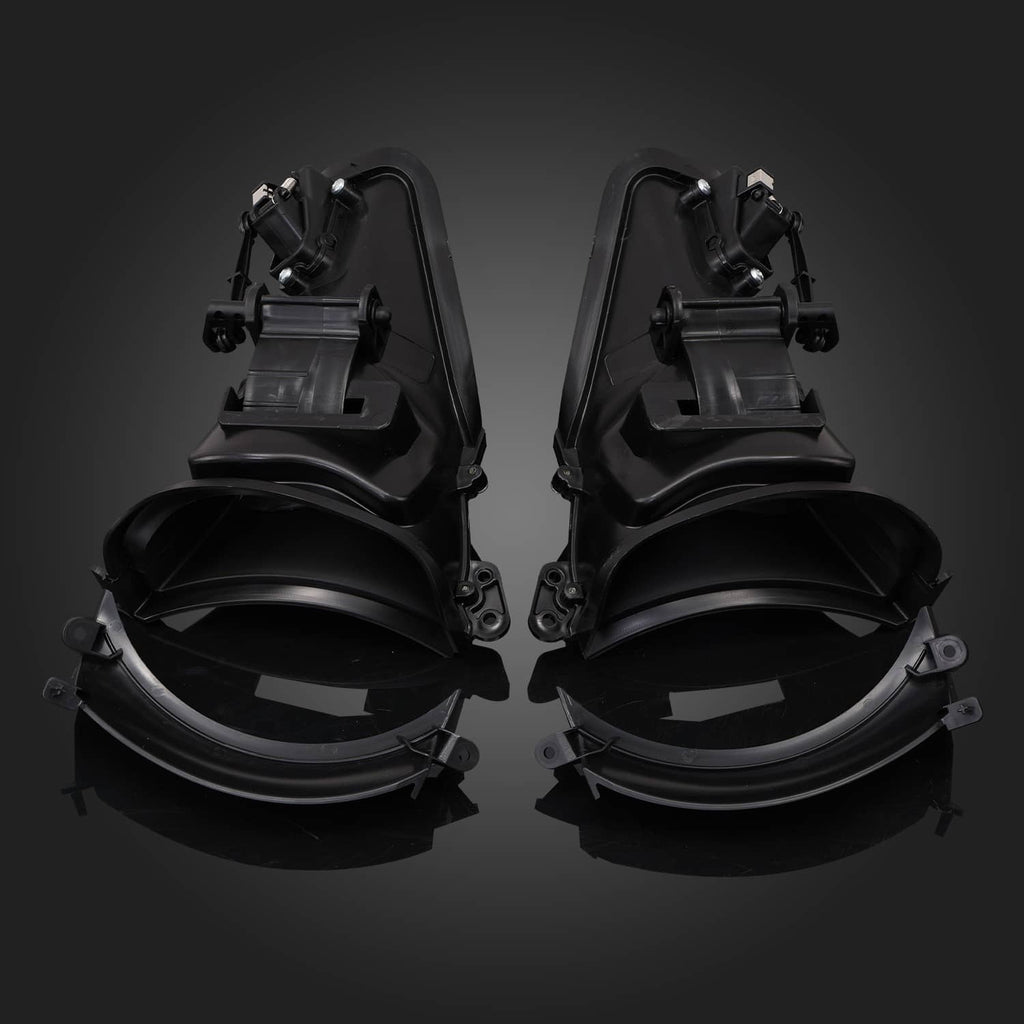 Pair of black motorcycle fairing air ducts with circular vent openings and mounting clips