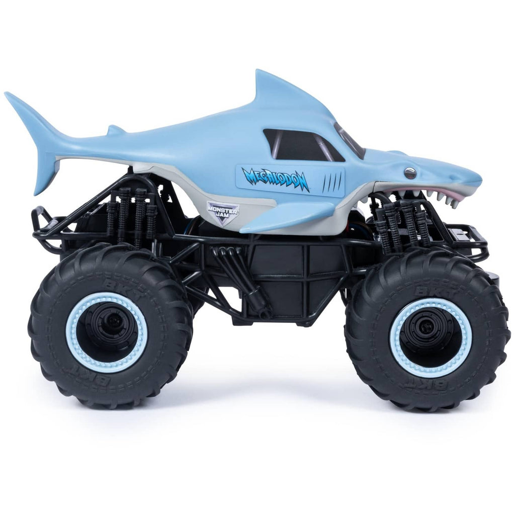 Shark-themed light blue RC monster truck with oversized black wheels and cage frame