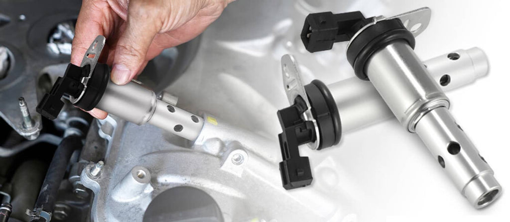 Variable timing solenoid valve installed in engine bay with black electrical plug