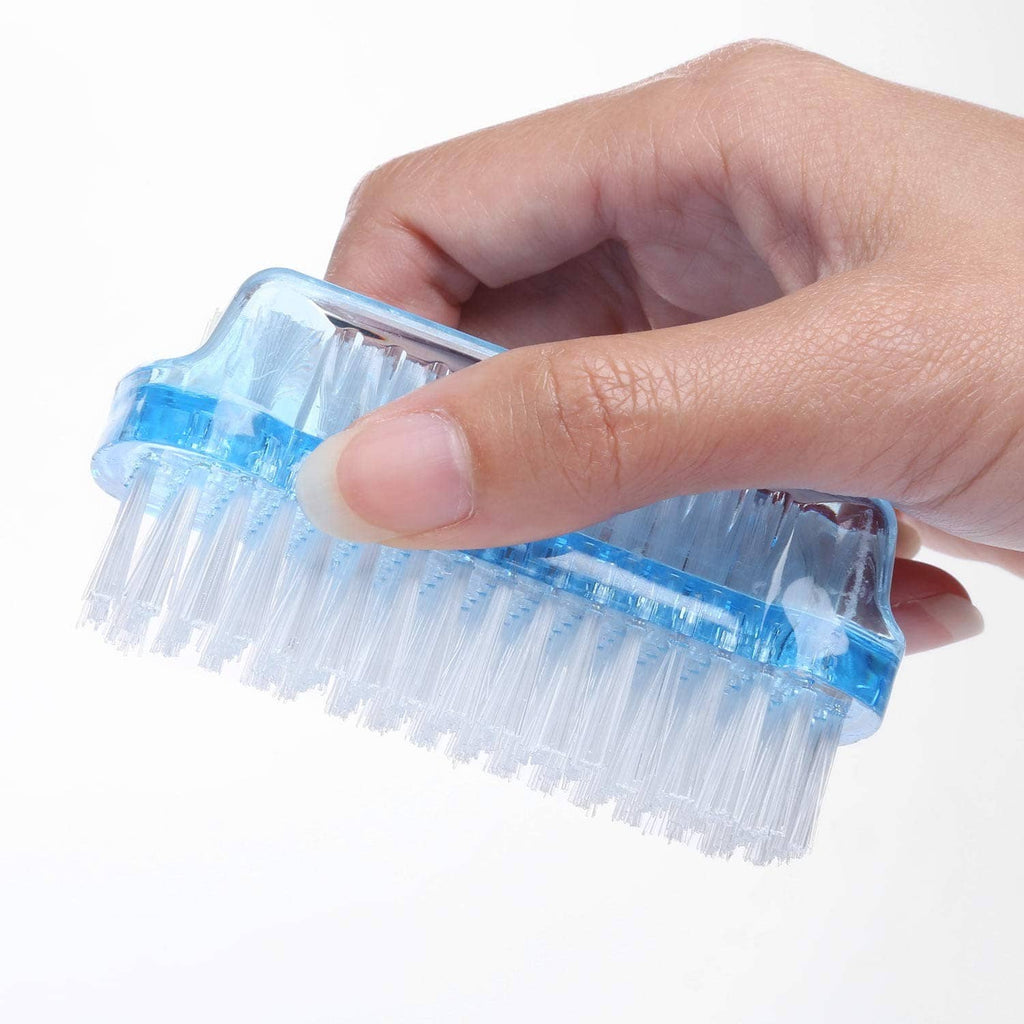 Dual-sided nail scrub brush with blue plastic body and white bristles held in hand