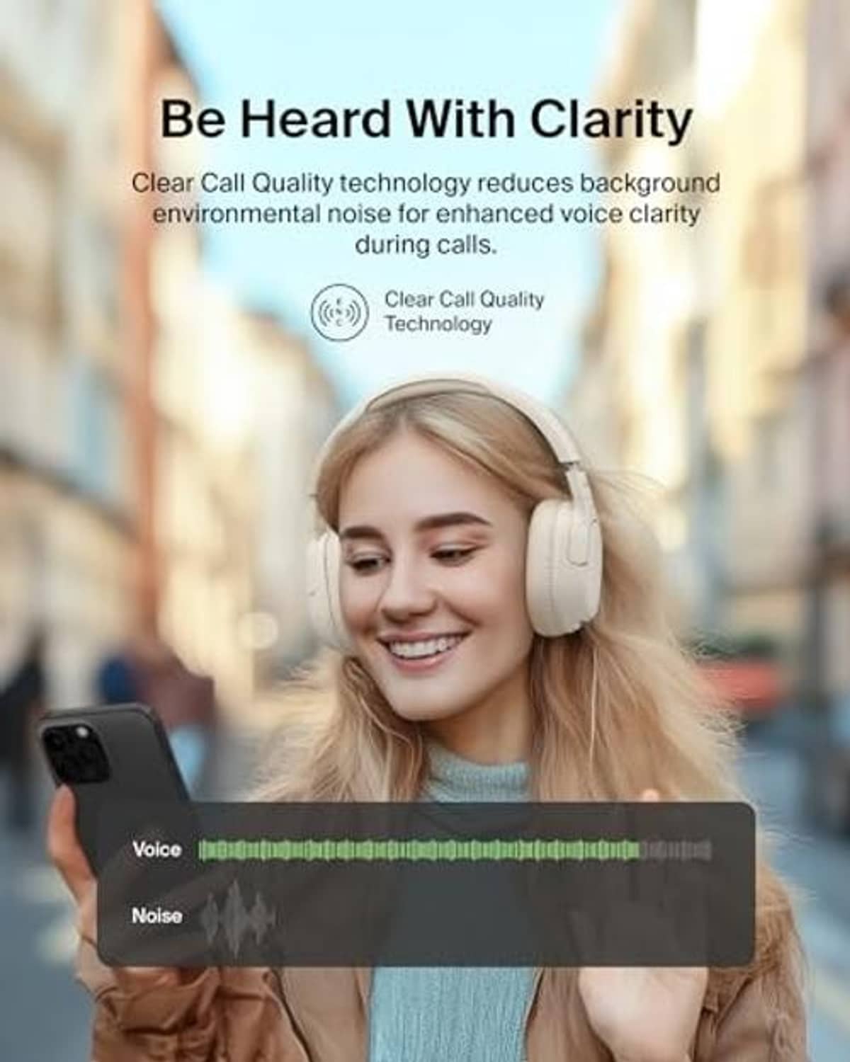 Cream over-ear ANC headphones on a person, with smartphone in hand for listening