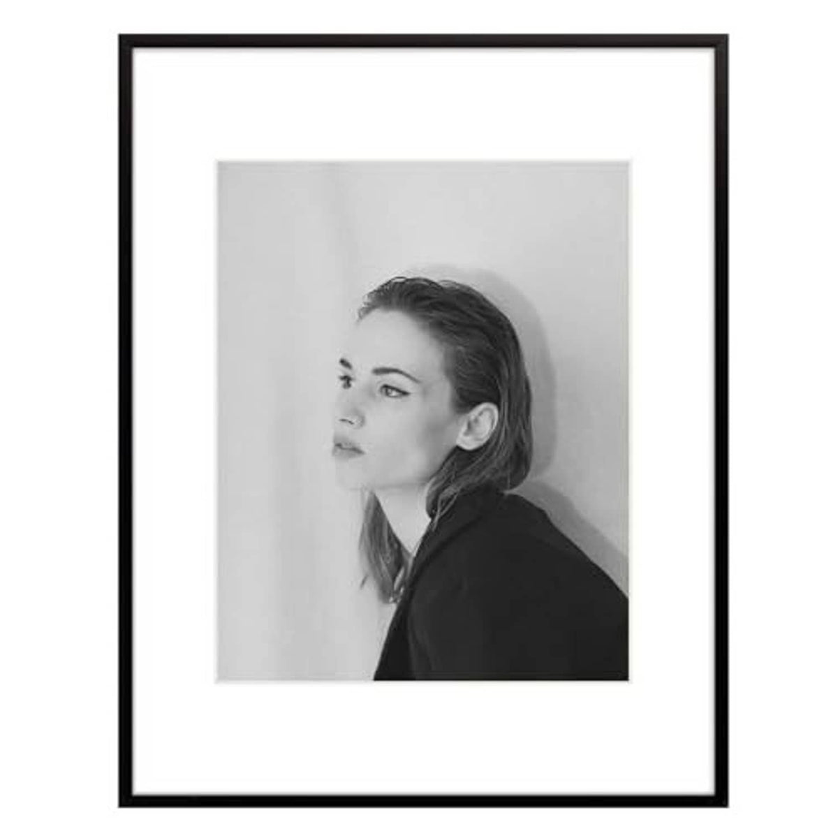 Black aluminum picture frame with white mat, grayscale portrait photo