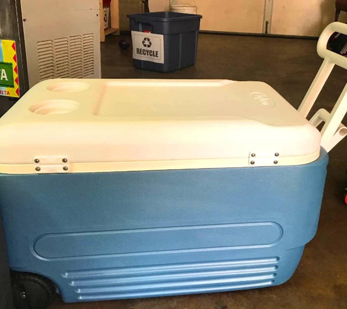 Blue and white cooler with hinge hardware on the lid front