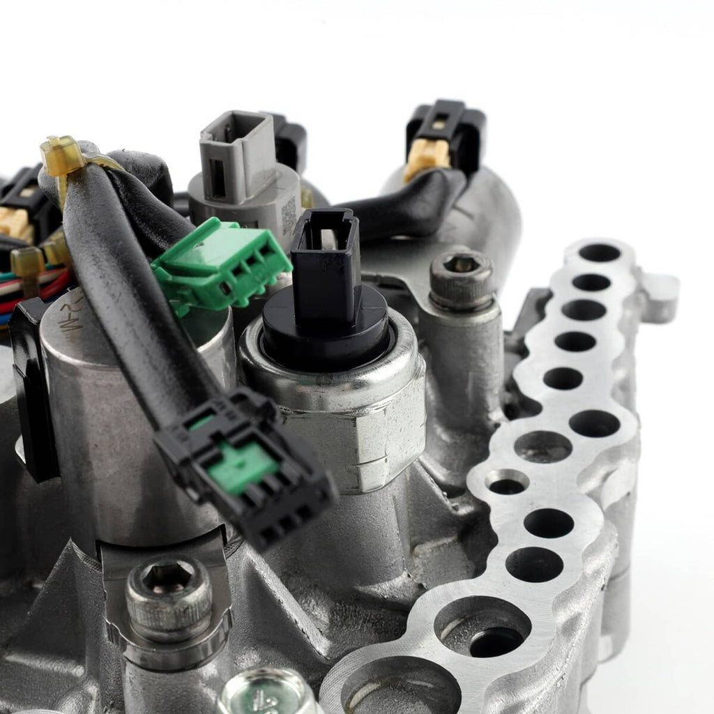 CVT transmission valve body close-up with electrical connectors and solenoid housings