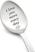Engraved love message spoon with beige bowl and silver handle, 'I love you more every day'