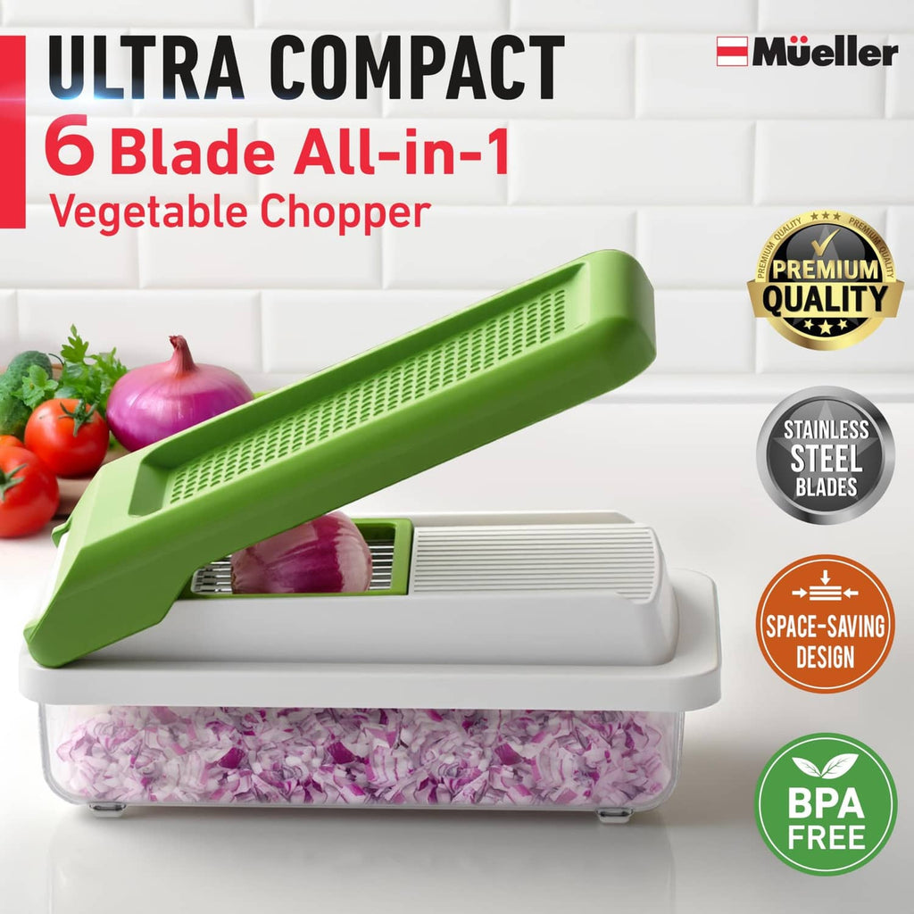 Green mandoline vegetable chopper with blade assembly and clear veggie container