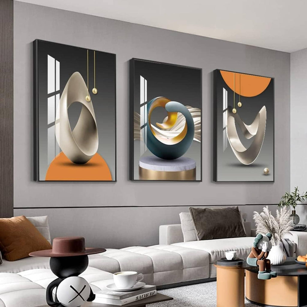 Three framed abstract prints on a wall with modern swirl and curved metal-like shapes