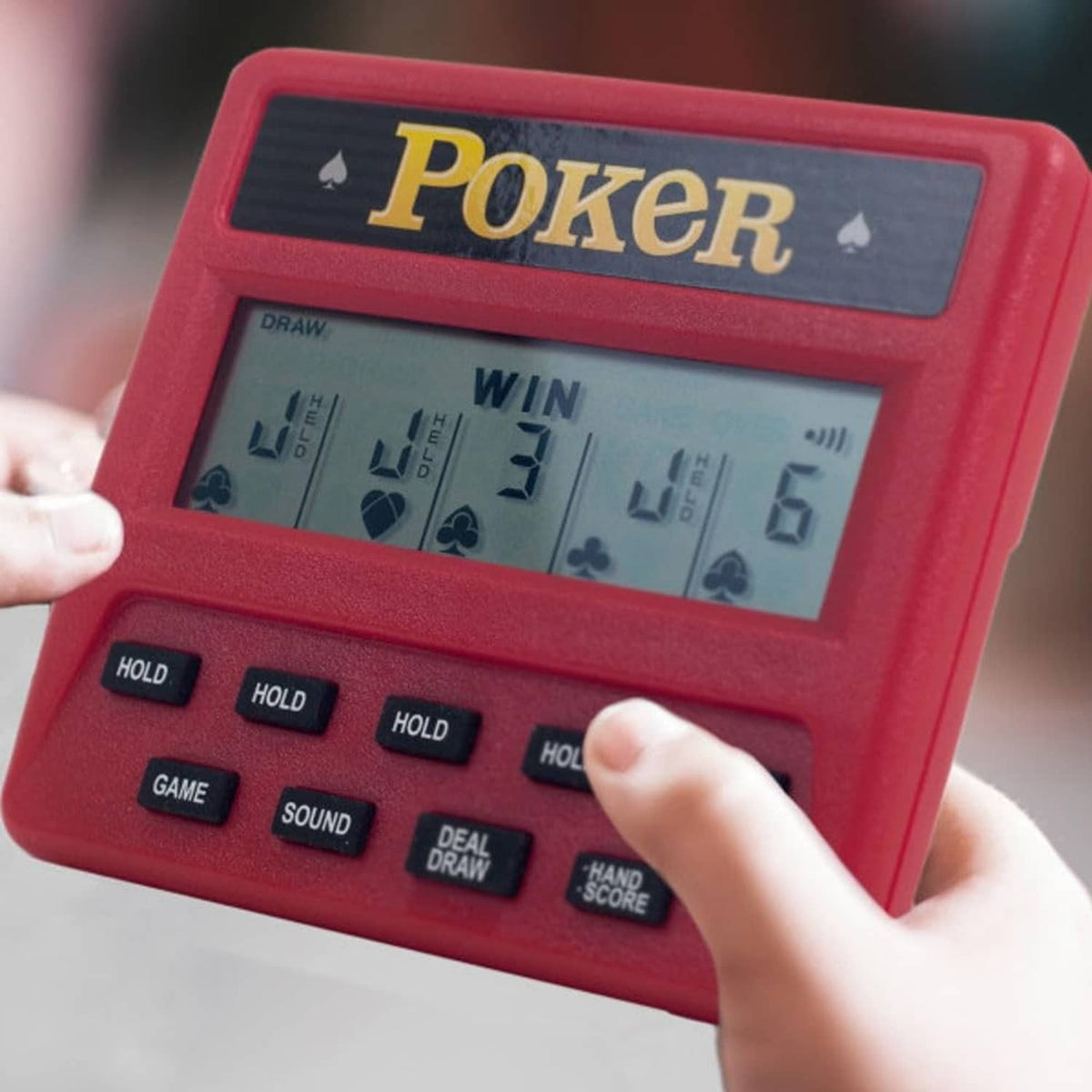 Red handheld poker game held in hand, showing LCD win and cards display.