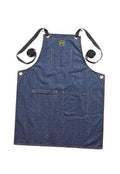 Blue denim grill apron with cross-back straps and two front pockets