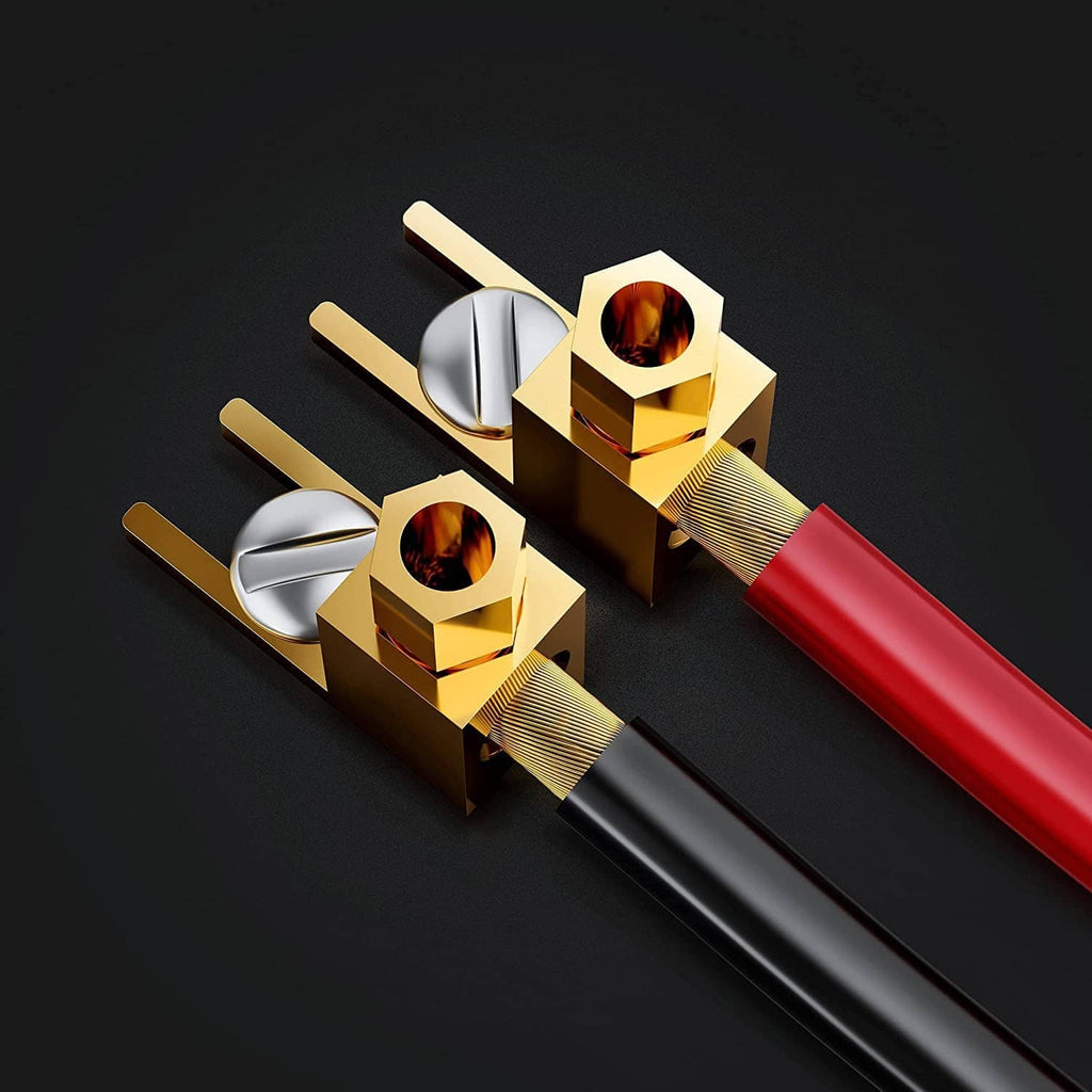 Gold spade plugs with red insulated cable and fork terminals, close-up on connectors